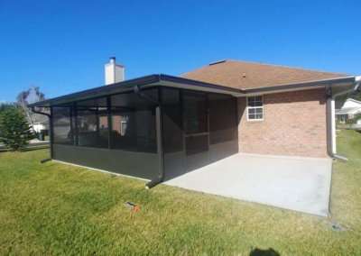 screen enclosure with extended concrete pad