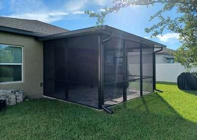New Smyrna Beach patio enclosure with insulated roof - side view