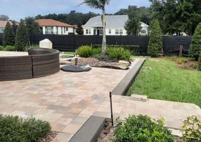 backyard patio extension with brick pavers