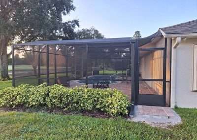 pool enclosure with patio paves