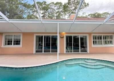 Pool enclosure with roof addition